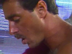 Ginger Lynn massages a big cock with her